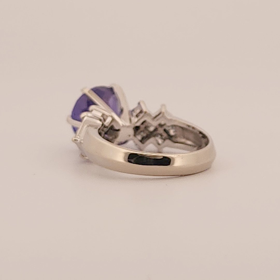 Natural Round Modified Brilliant Cut, Bluish Violet Tanzanite (5.25 CT - 10.20 mm) with 12 Natural Princess cut 3x3 mm Square Diamonds (1.92 CTW) Ring 14K White Gold. GIA Certified (2231466864).