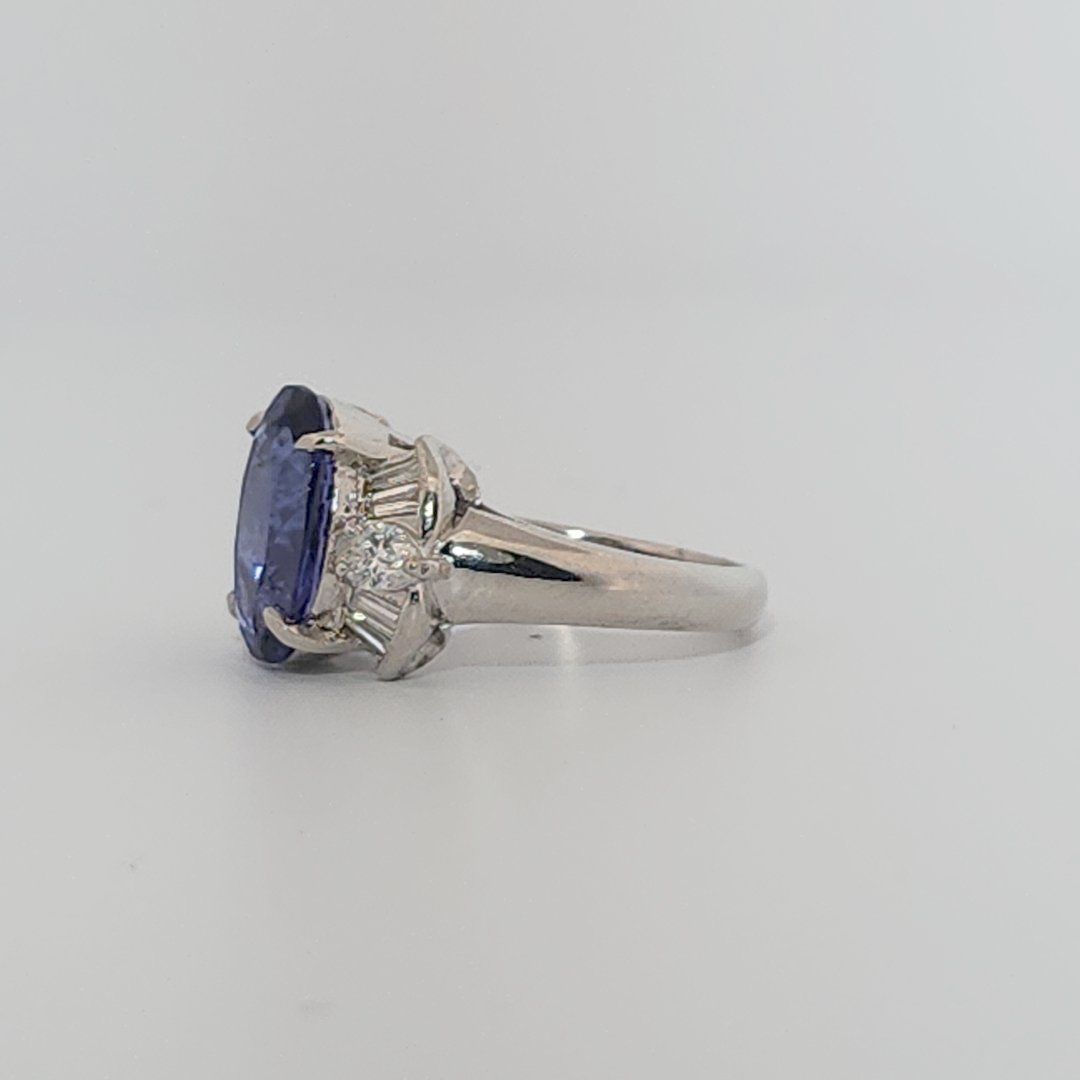 Modified Brilliant Cut, Oval Shape, Bluish Violet Tanzanite (4.38CT, 12.77 x 8.29 x 5.57 mm), Mounted at Platinum 900 Ring with Natural Diamonds (0.60 CTW, E/F-VS). GIA Certified (5232466621). Size 5.75
