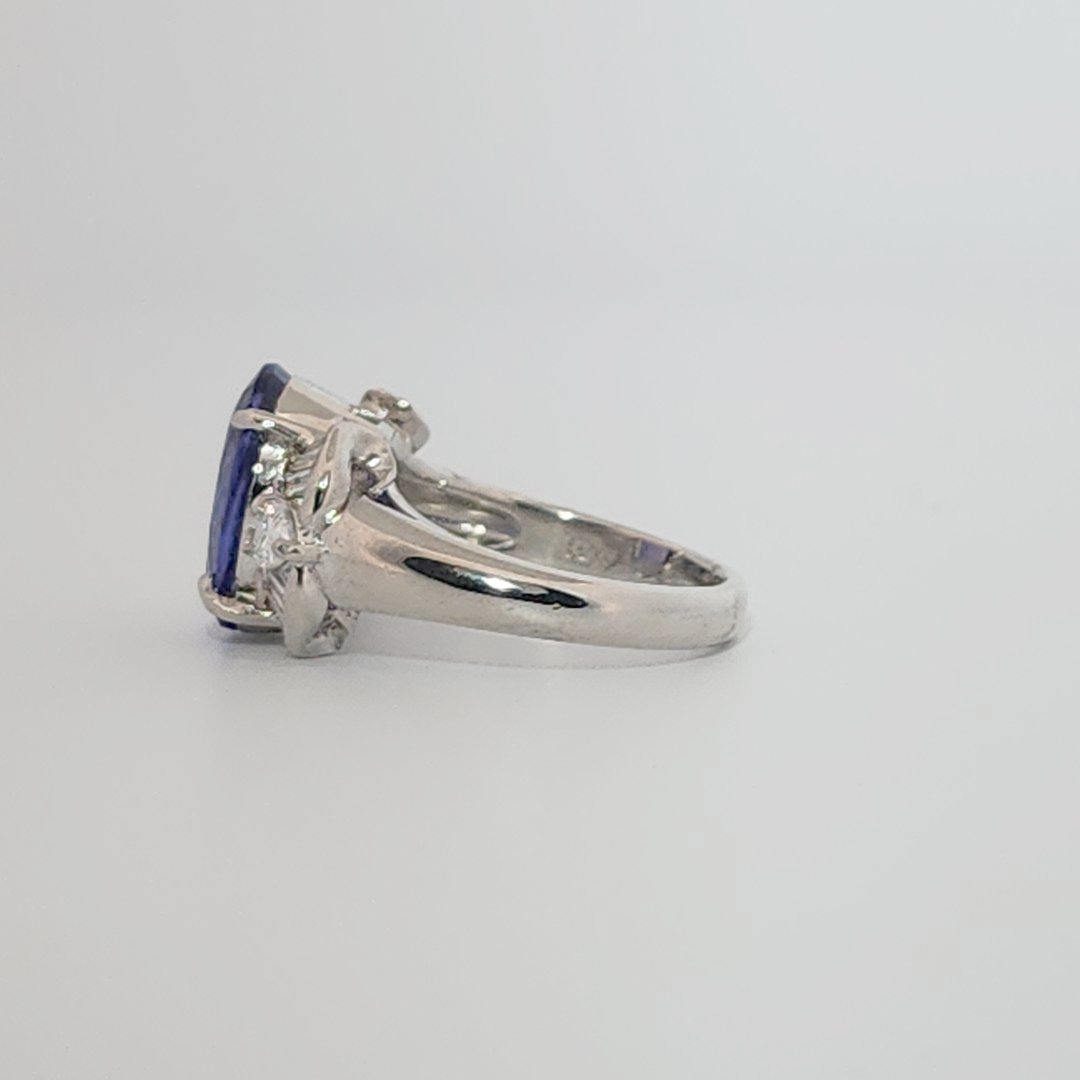 Modified Brilliant Cut, Oval Shape, Bluish Violet Tanzanite (4.38CT, 12.77 x 8.29 x 5.57 mm), Mounted at Platinum 900 Ring with Natural Diamonds (0.60 CTW, E/F-VS). GIA Certified (5232466621). Size 5.75