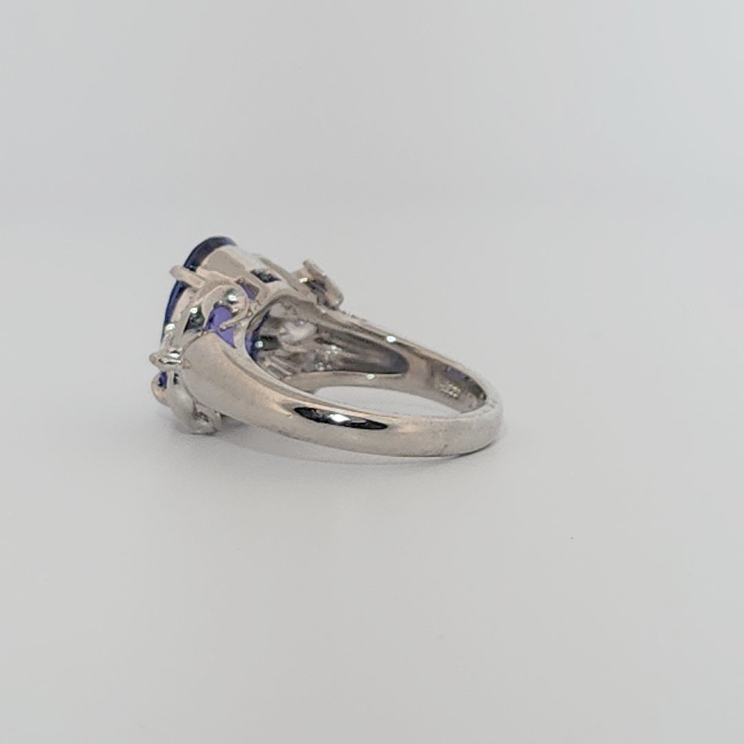 Modified Brilliant Cut, Oval Shape, Bluish Violet Tanzanite (4.38CT, 12.77 x 8.29 x 5.57 mm), Mounted at Platinum 900 Ring with Natural Diamonds (0.60 CTW, E/F-VS). GIA Certified (5232466621). Size 5.75