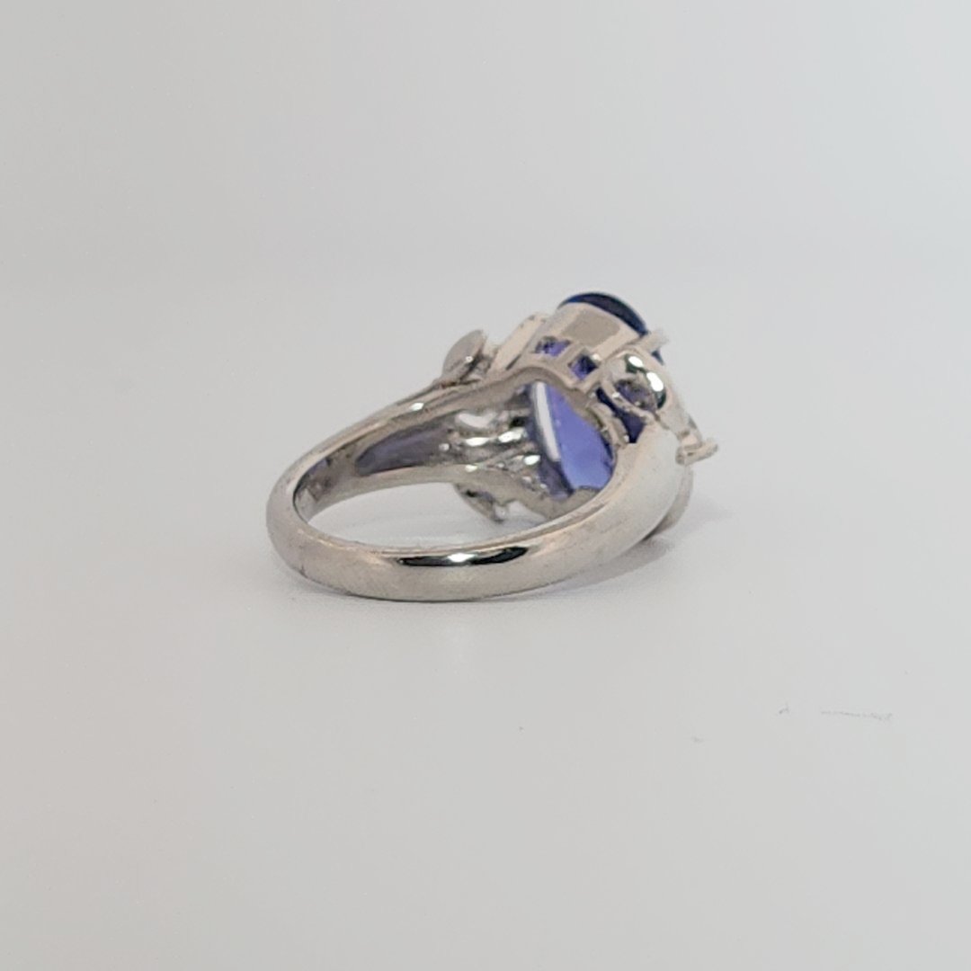 Modified Brilliant Cut, Oval Shape, Bluish Violet Tanzanite (4.38CT, 12.77 x 8.29 x 5.57 mm), Mounted at Platinum 900 Ring with Natural Diamonds (0.60 CTW, E/F-VS). GIA Certified (5232466621). Size 5.75