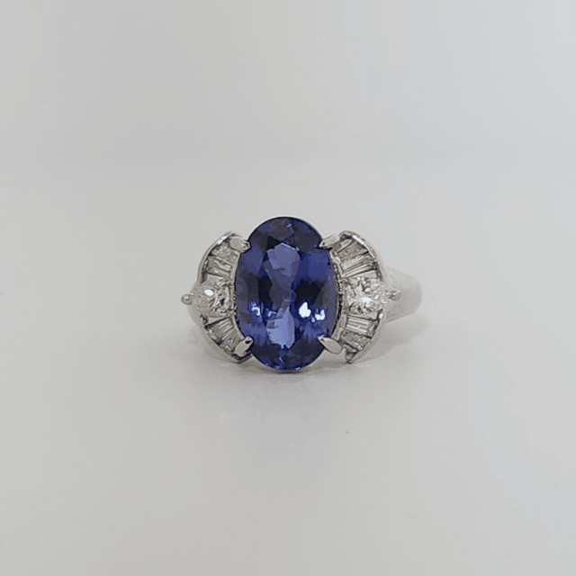 Modified Brilliant Cut, Oval Shape, Bluish Violet Tanzanite (4.38CT, 12.77 x 8.29 x 5.57 mm), Mounted at Platinum 900 Ring with Natural Diamonds (0.60 CTW, E/F-VS). GIA Certified (5232466621). Size 5.75