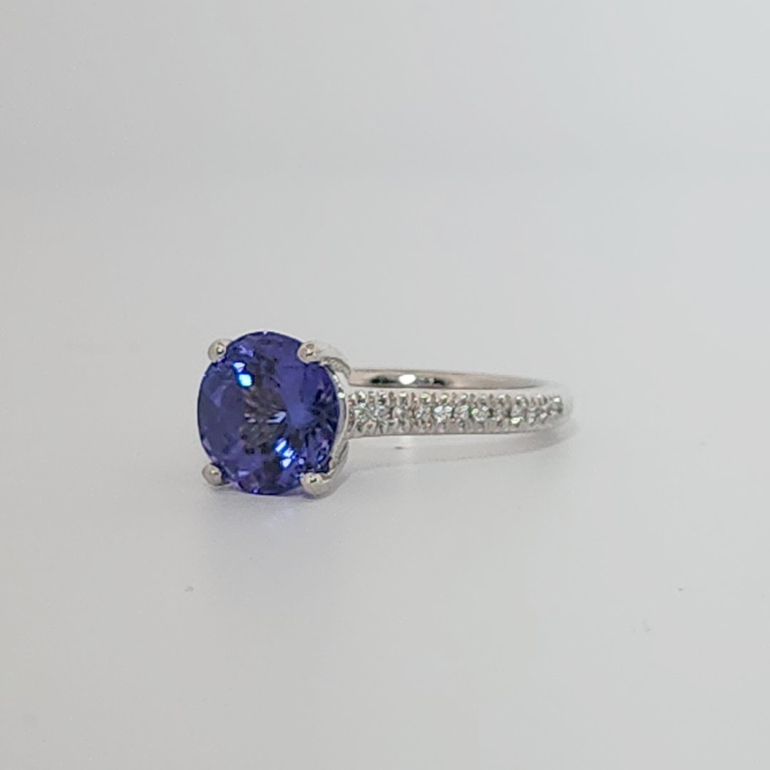 Modified Brilliant Cut, Round Shape, Bluish Violet Tanzanite (2.80CT, 8.89 - 9.01 x 5.53 mm), Mounted at Platinum 950 ring with Natural Diamonds (0.18 CTW E/F-SI). GIA Certified (5231466569). Size 5.25