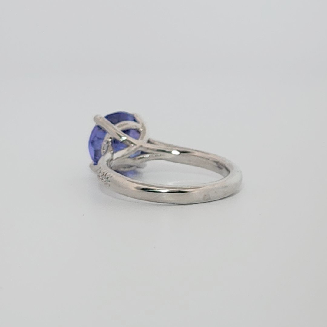 Modified Brilliant Cut, Round Shape, Bluish Violet Tanzanite (2.80CT, 8.89 - 9.01 x 5.53 mm), Mounted at Platinum 950 ring with Natural Diamonds (0.18 CTW E/F-SI). GIA Certified (5231466569). Size 5.25