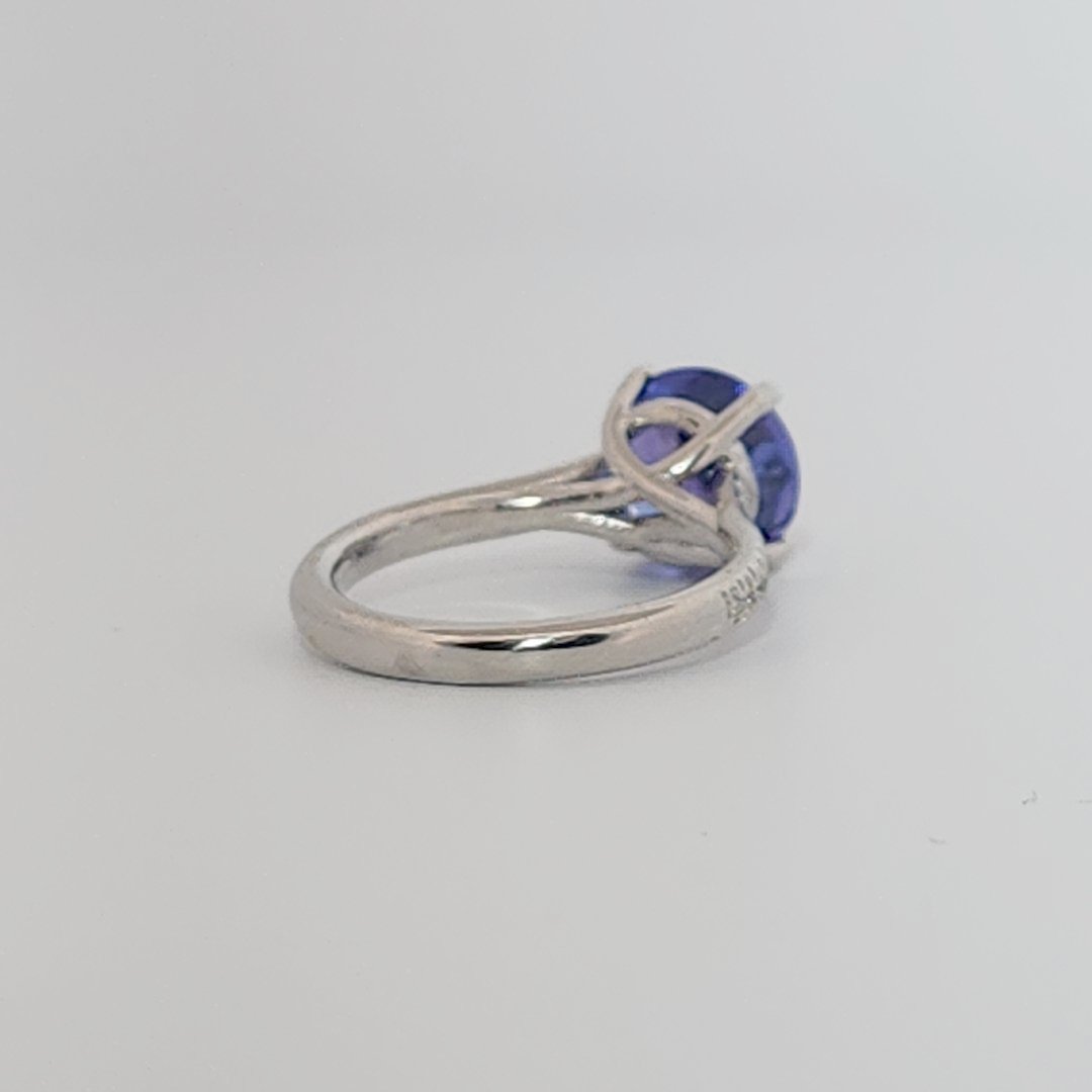 Modified Brilliant Cut, Round Shape, Bluish Violet Tanzanite (2.80CT, 8.89 - 9.01 x 5.53 mm), Mounted at Platinum 950 ring with Natural Diamonds (0.18 CTW E/F-SI). GIA Certified (5231466569). Size 5.25