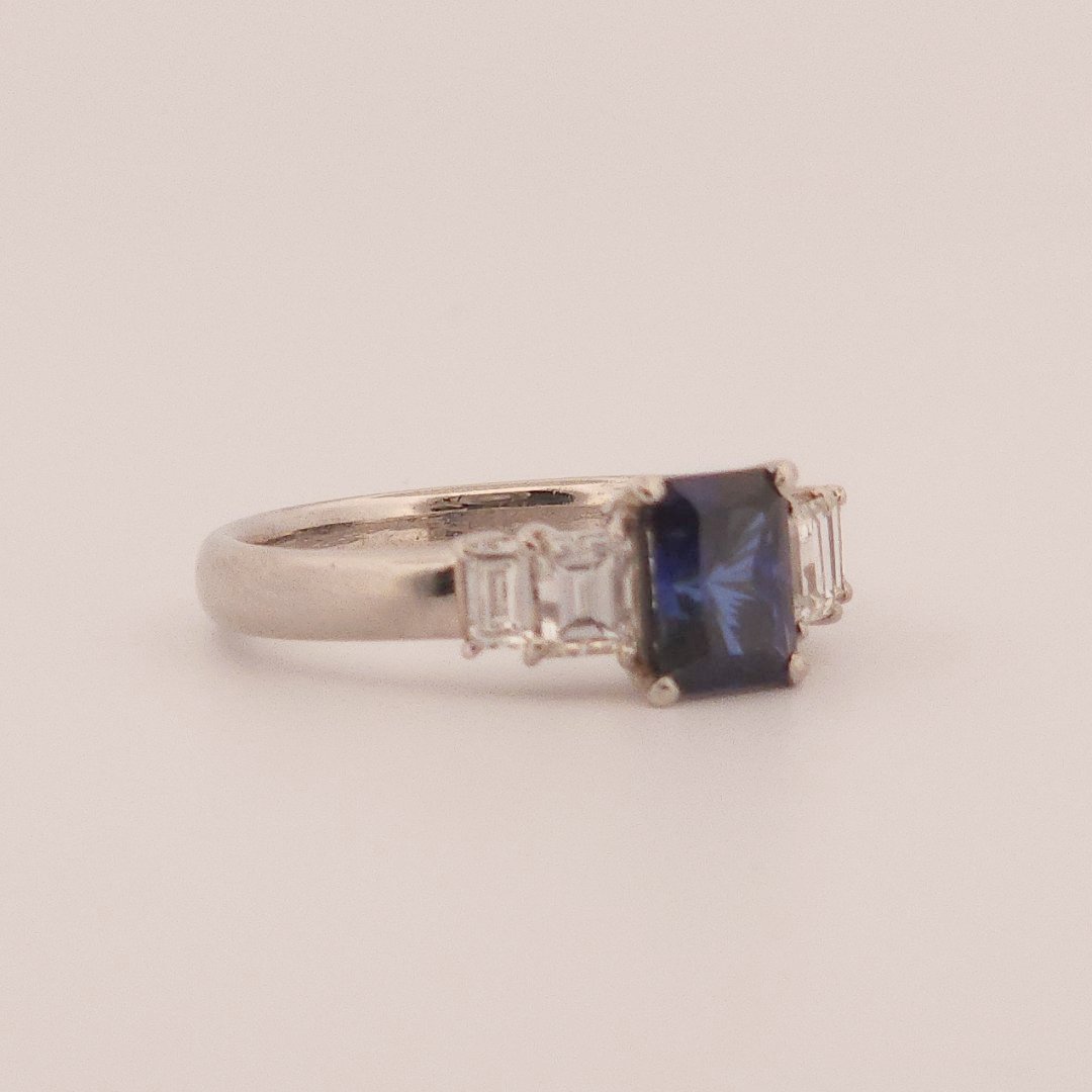 Emerald Step-Cut, AAA Natural Blue Sapphire (1.15CT, 7x5mm), Mounted on Platinum 900 Ring with Natural Diamonds (0.77 CTW, E/F VS1/VS2). Size 7.25