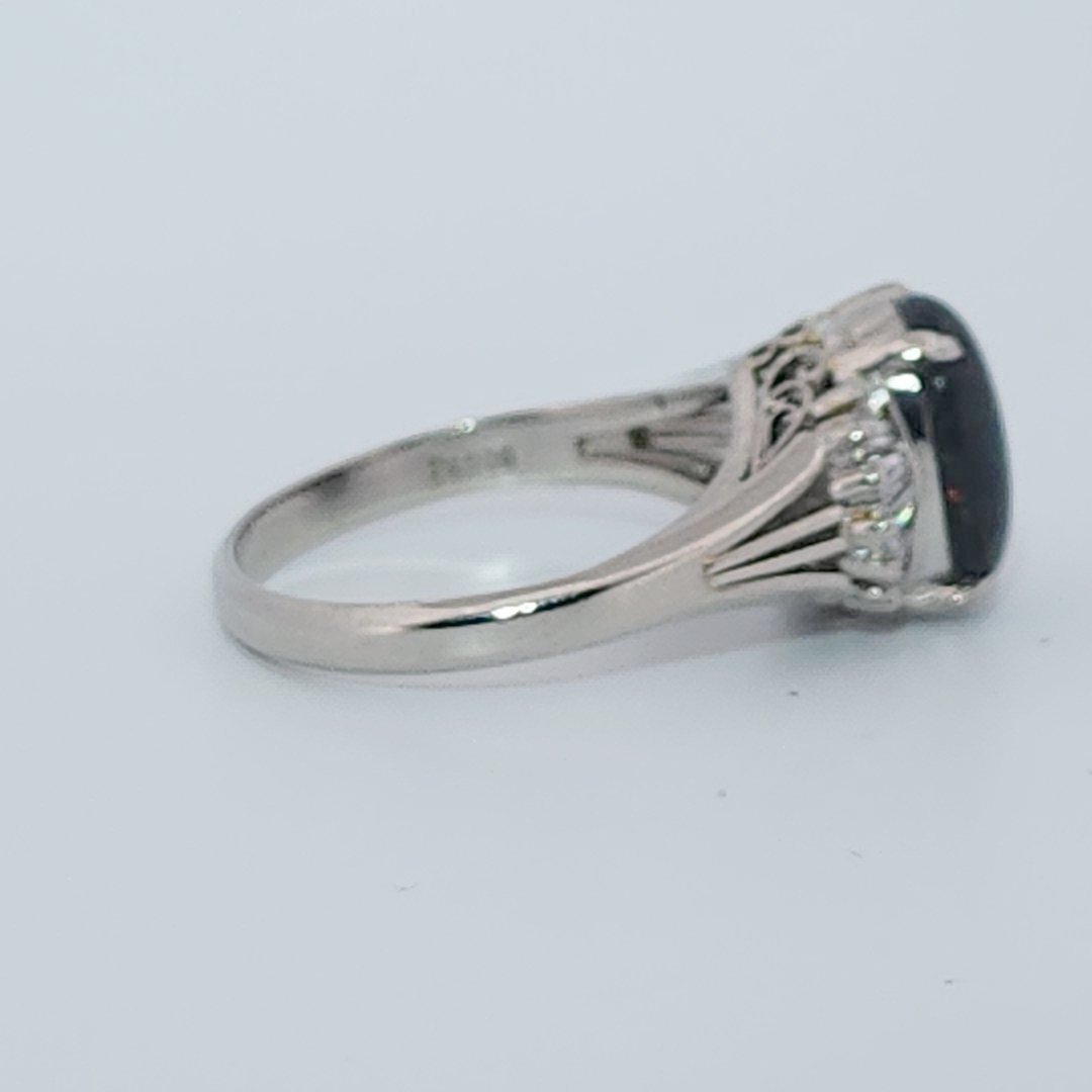 DATA_MISMATCH: Black Opal Ring vs Opal 2.6ct (typical white/translucent) | Platinum Ring, set with 1 Opal (2.6ct, dark/black) and Diamonds (0.485ct total), 8g