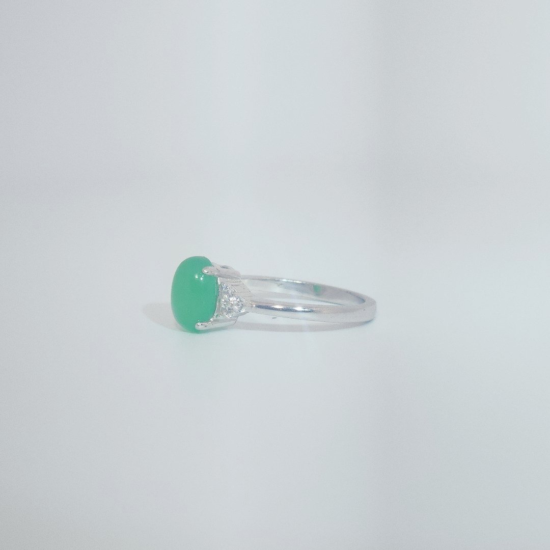 Women's Sterling Silver Ring with oval cabochon Jade center stone flanked by small white accent stones, size 7.