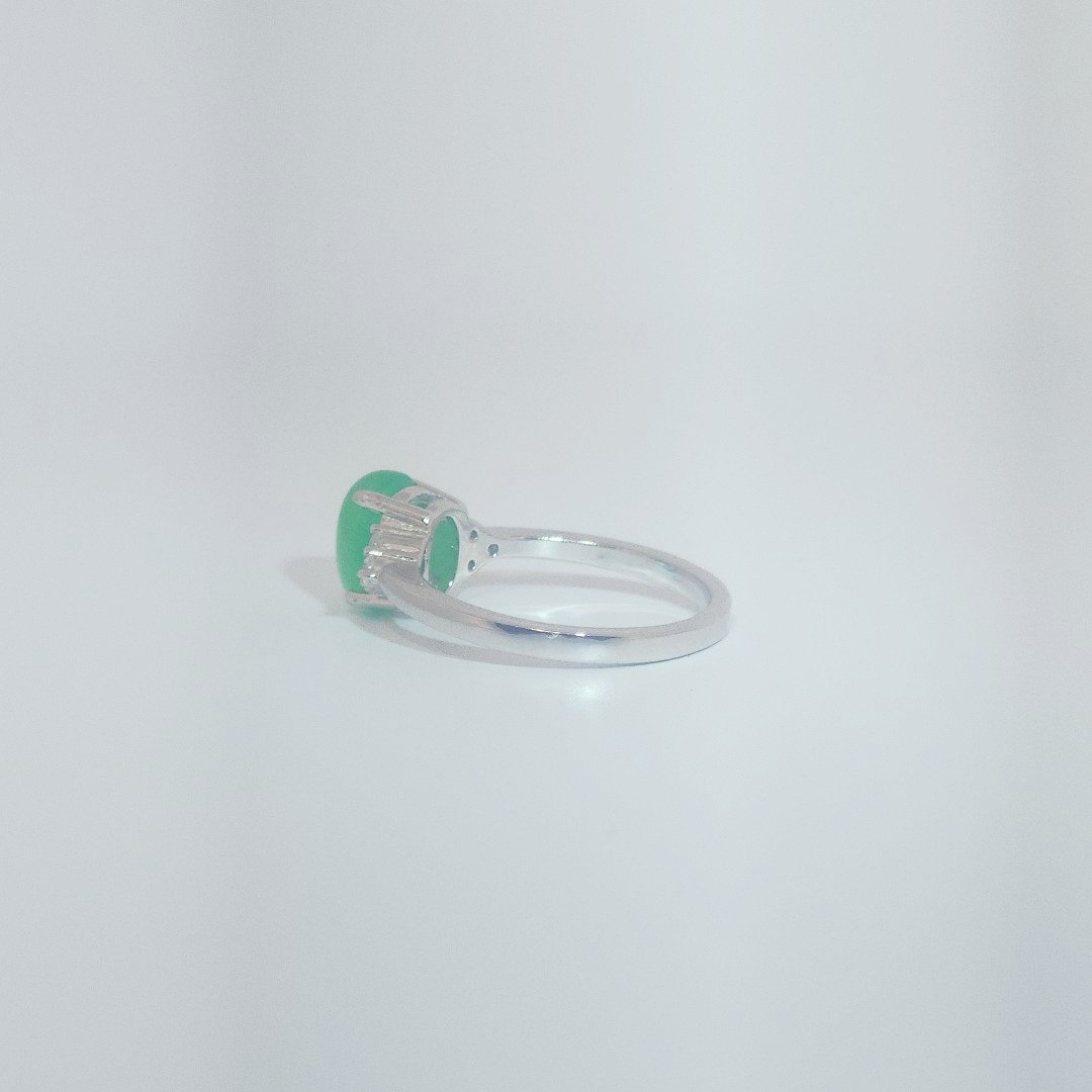 Women's Sterling Silver Ring with oval cabochon Jade center stone flanked by small white accent stones, size 7.