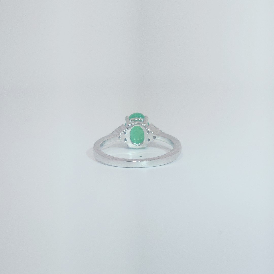 Women's Sterling Silver Ring with oval cabochon Jade center stone flanked by small white accent stones, size 7.