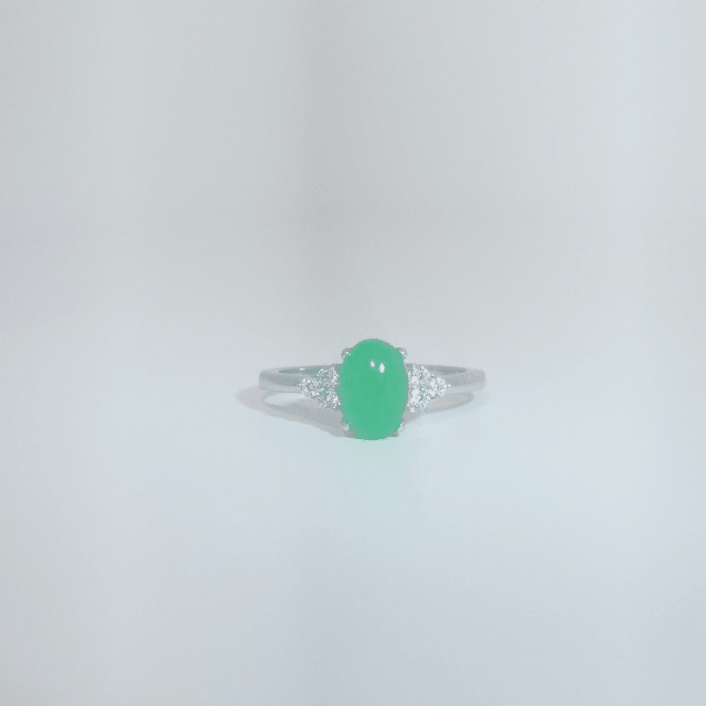 Women's Sterling Silver Ring with oval cabochon Jade center stone flanked by small white accent stones, size 7.