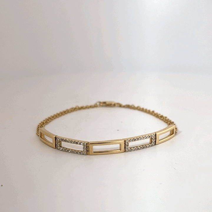 Female Geometric Bracelet, 14K Yellow Gold with diamond accents totaling 0.24ct.